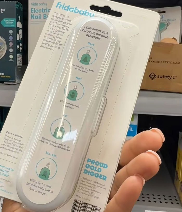 Frida Mom product packaging showing inappropriate marketing wording for baby care tool in store shelf display.