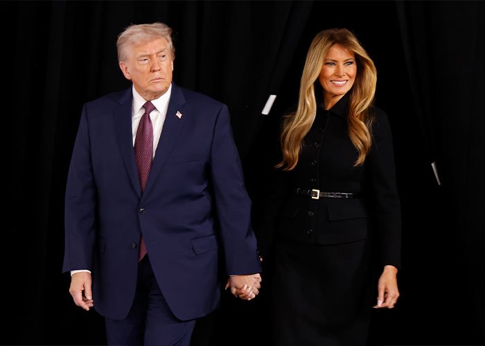 Donald Trump in navy suit holding hands with Melania Trump in black outfit against black background for poll.