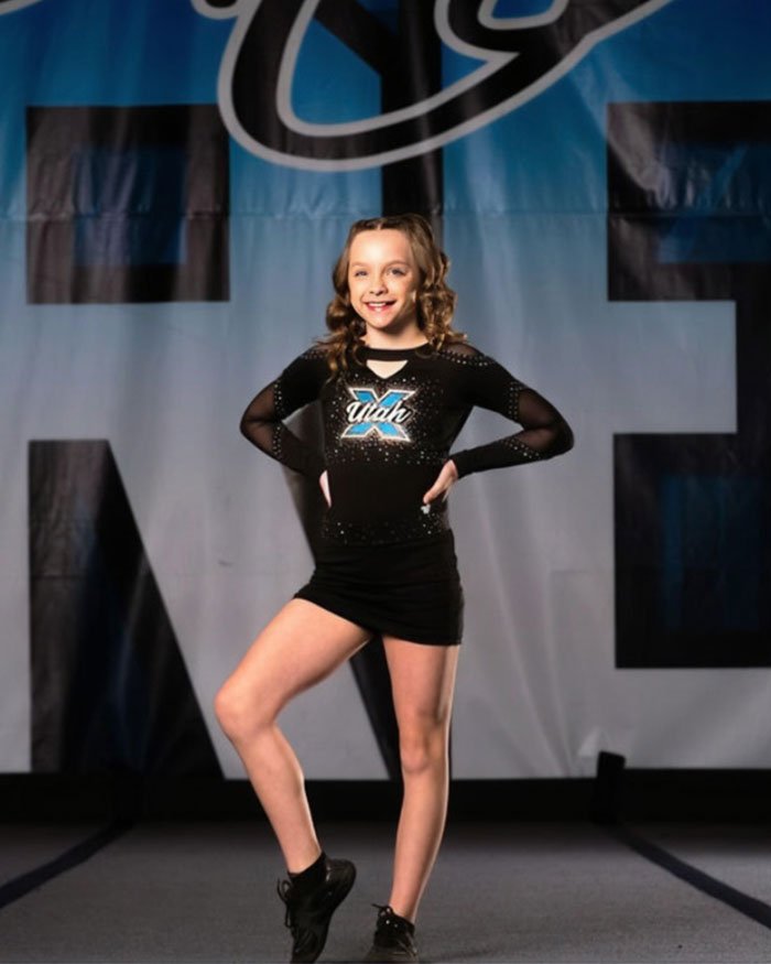 Young Utah dance mom performing on stage in black outfit, representing Utah Dance Mom’s parent clash in Vegas tragedy context.