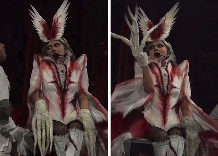 Lady Gaga in a scary costume with skeletal gloves and dramatic makeup displaying disturbed and confused mannerisms on stage.