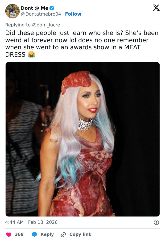 Lady Gaga wearing a meat dress with white and blue hair, showcasing her disturbed and scary look at a recent concert.