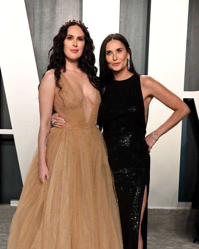 Rumer Willis and Demi Moore posing together at an event, highlighting Rumer's work despite famous parents.