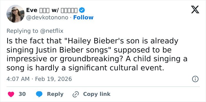 Tweet screenshot showing a user questioning Hailey Bieber&rsquo;s claim about her toddler son singing Justin Bieber songs, met with skepticism.