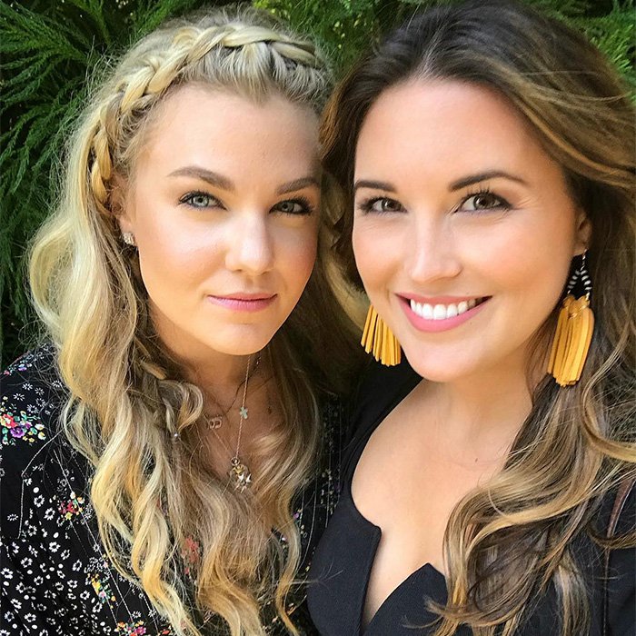 Two women smiling together outdoors, highlighting Erika Kirk and her closet lesbian rumored interactions.