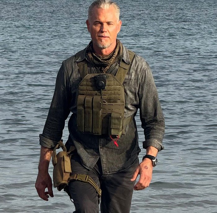 Man in tactical gear walking through water, illustrating doctors breaking down commonly ignored ALS symptoms.