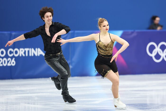 Male and female figure skaters performing on ice at Winter Olympics venue, highlighting Winter Olympics host controversy.