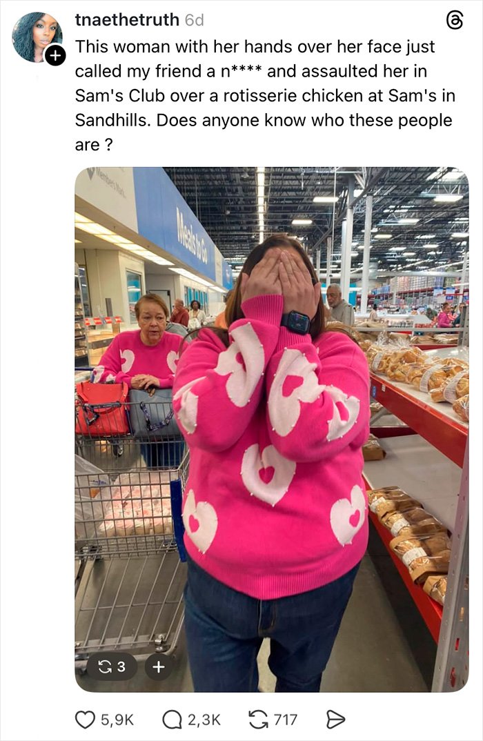 Woman in pink heart sweater covering face in a store, related to teacher jailed over alleged racist attack incident.