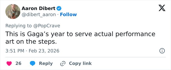 Tweet from Aaron Dibert replying to PopCrave about the Met Gala 2026 dress code sparking controversy and mixed reactions.