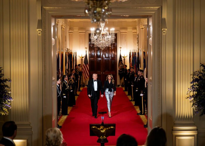 Melania Trump and Donald Trump walking down red carpet at governors dinner, Melania’s outfit sparks fierce backlash