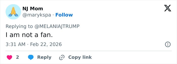 Screenshot of a Twitter reply criticizing Melania Trump’s governors dinner outfit, sparking fierce backlash.