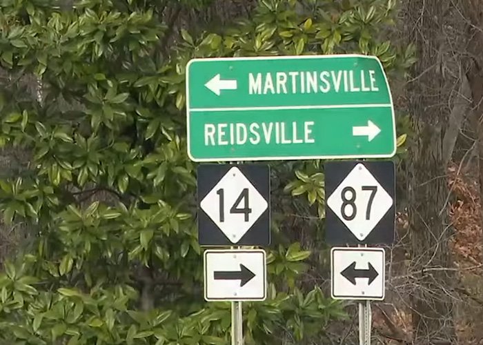 Road signs for Martinsville and Reidsville in North Carolina, related to North Carolina mom who disappeared 24 years ago.