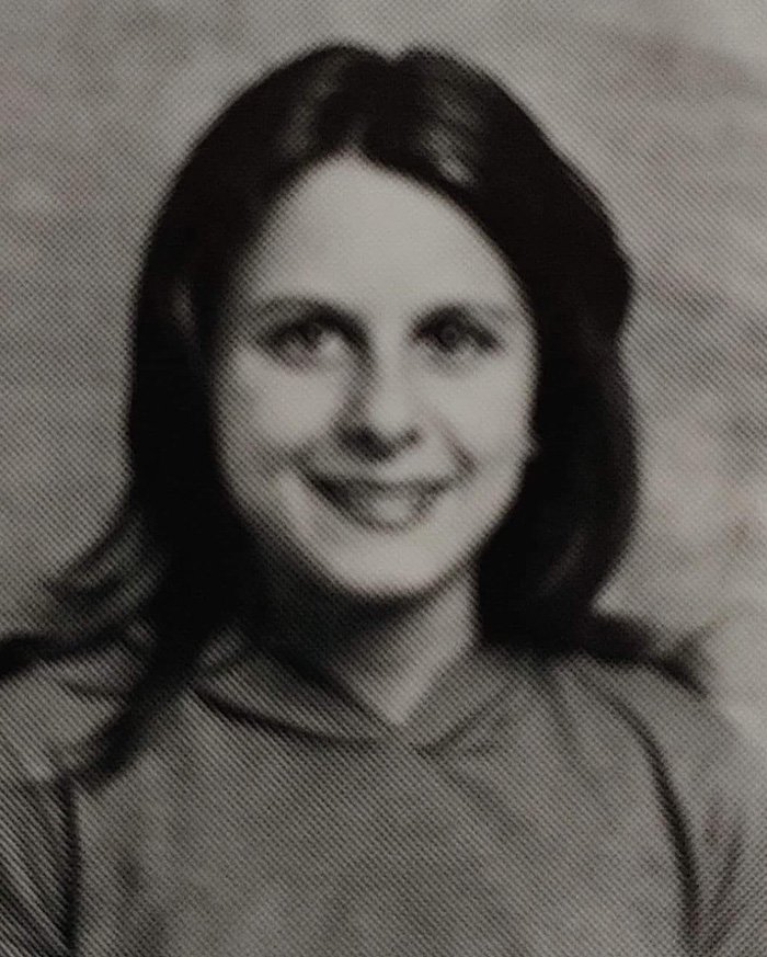 Black and white photo of a North Carolina mom of three who disappeared 24 years ago smiling at the camera