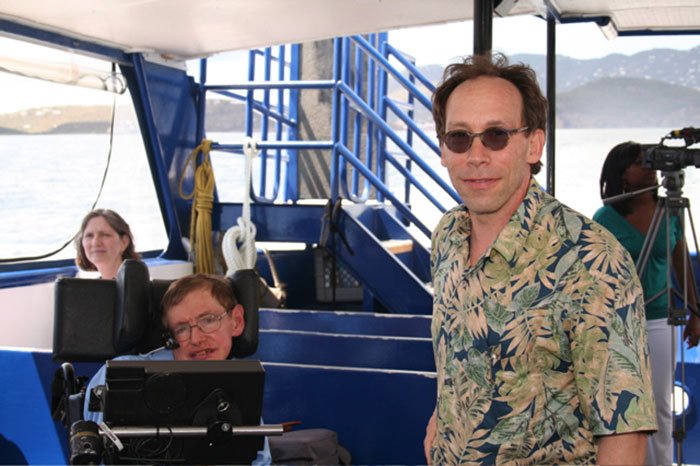 Stephen Hawking with family on a boat, sparking reactions related to Epstein files and raunchy pics explanation.