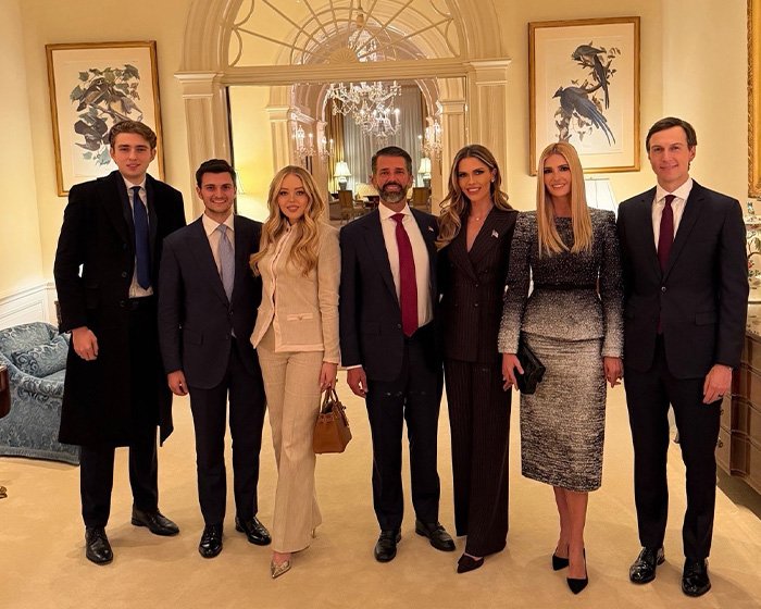 Group photo of Barron, Ivanka, and family in formal attire, related to lip reader's claim about rude words during State of the Union.