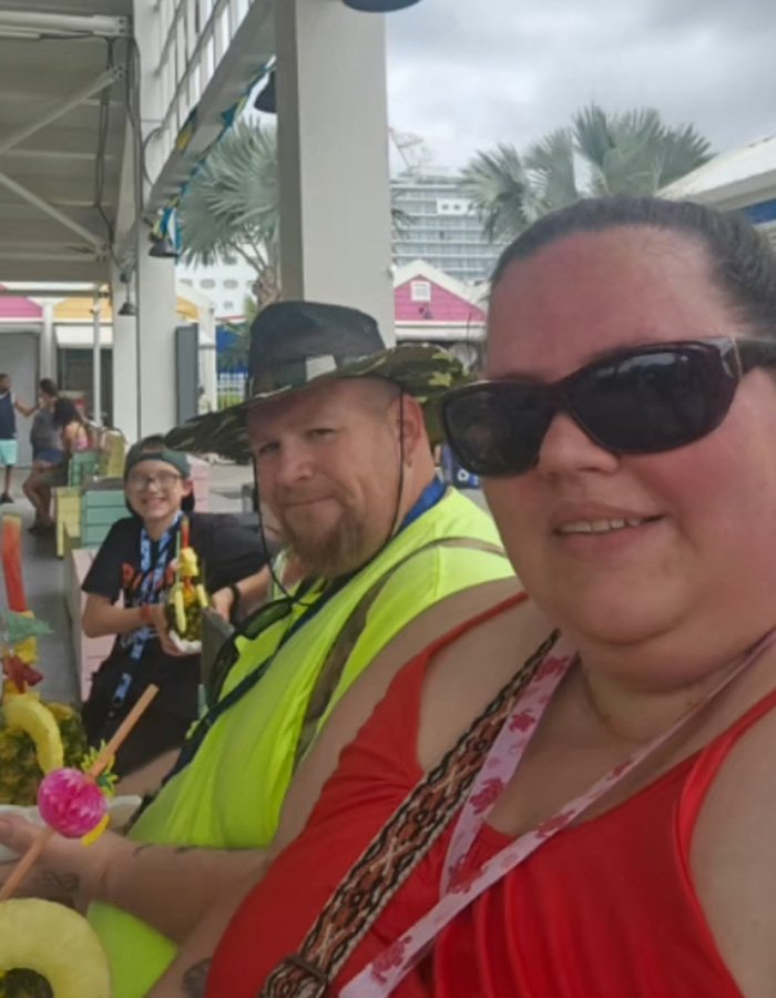 Heartbroken mom and family spending time together outdoors, reflecting on adoptive father's slaying case.