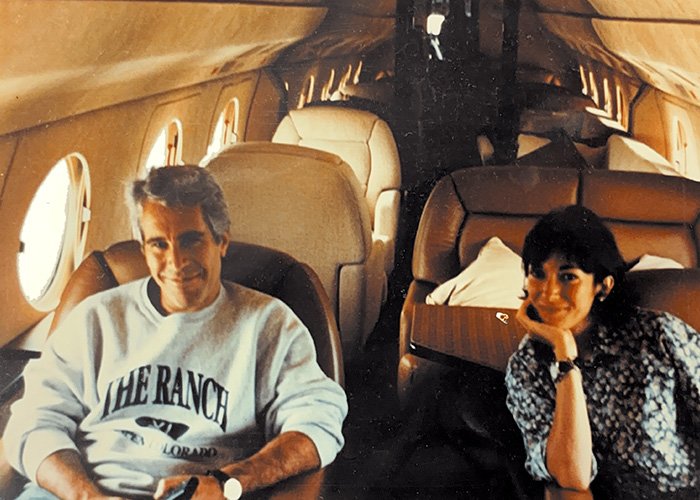 Man and woman seated inside a private jet, relating to Bill Clinton releases fiery statement on Epstein ties topic.