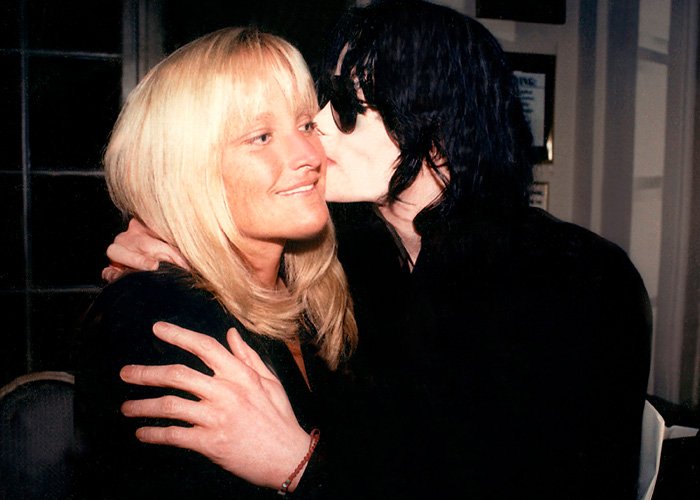 Michael Jackson embracing Debbie Rowe, highlighting fan interest in the mystery of Paris Jackson&rsquo;s biological dad.