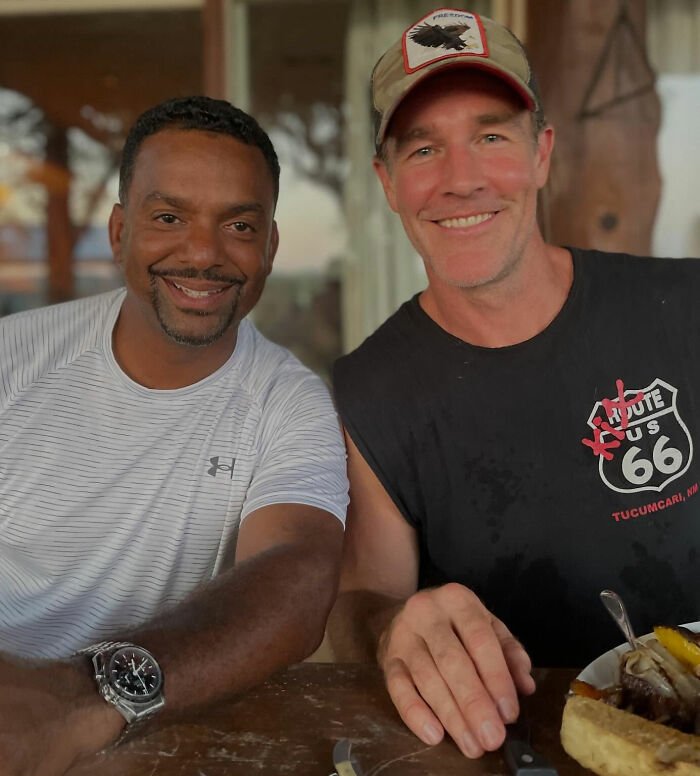 Alfonso Ribeiro and James Van Der Beek smiling together in a casual setting sharing a heartfelt moment.