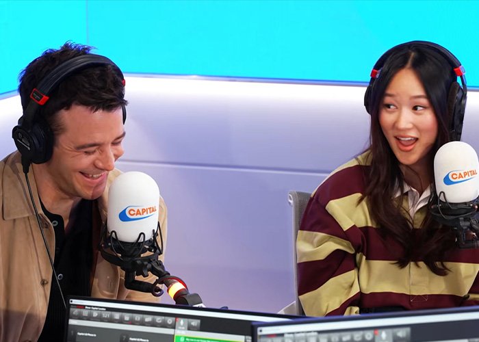 Bridgerton star and co-actor laughing during a radio interview about their steamy bathtub scene experience.