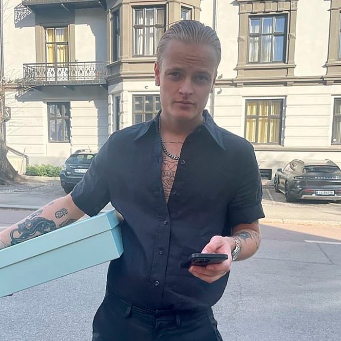 Young man with tattoos outside a building, representing son of Norway's crown princess facing court on charges.
