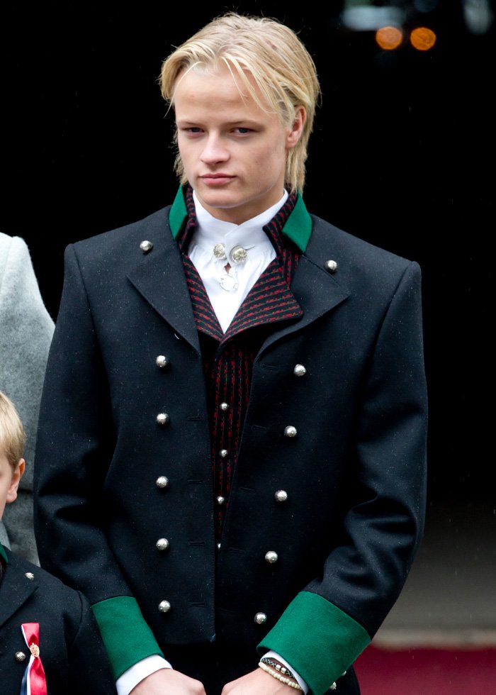 Son of Norway’s crown princess wearing traditional attire, facing court over horrific charges in high-profile legal case.