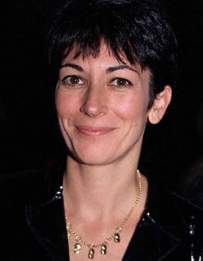 Close-up portrait of Ghislaine Maxwell smiling with short dark hair, highlighting internet users questioning her prison appearance theory.
