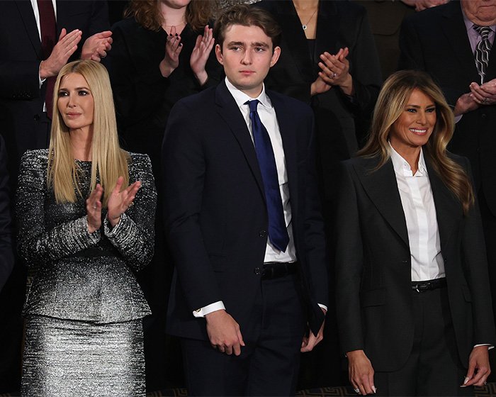 Ivanka Trump, Barron Trump, and Melania Trump standing together during a formal event with a lip reader claim context.