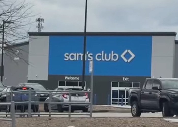 Sam's Club storefront with parked cars outside, unrelated to teacher jailed over alleged racist attack news.