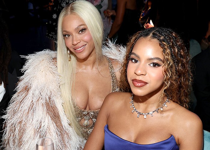 Beyoncé and Blue Ivy posing together at an event, showcasing Blue Ivy's striking resemblance to her mom.