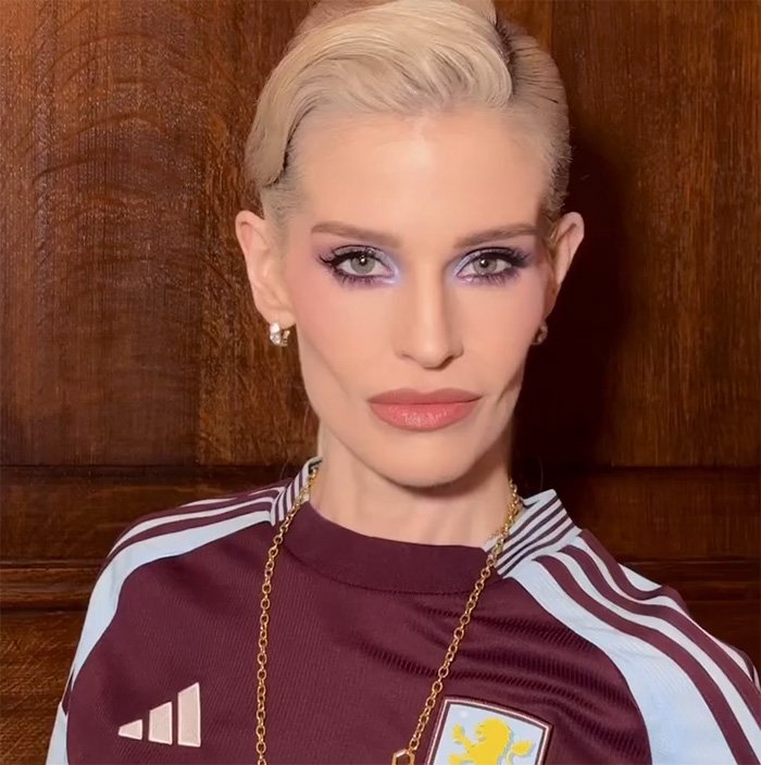 Kelly Osbourne with sharp facial features and bold makeup, sparking fans' talk of buccal fat removal after Brit Awards look.