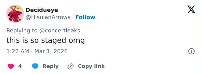 Twitter reply showing a user commenting on chaos at Brit Awards as singer gets pushed off stage mid performance.