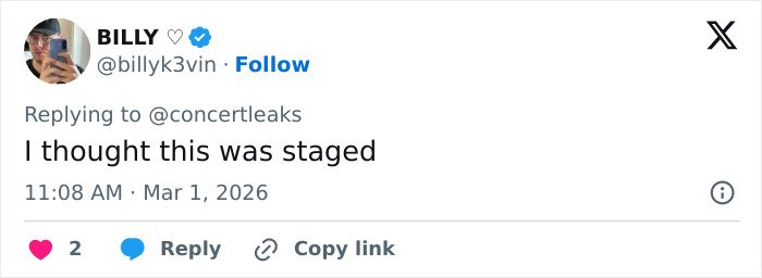 Tweet screenshot showing a user reacting to chaos at Brit Awards as singer gets pushed off stage mid performance in viral video.